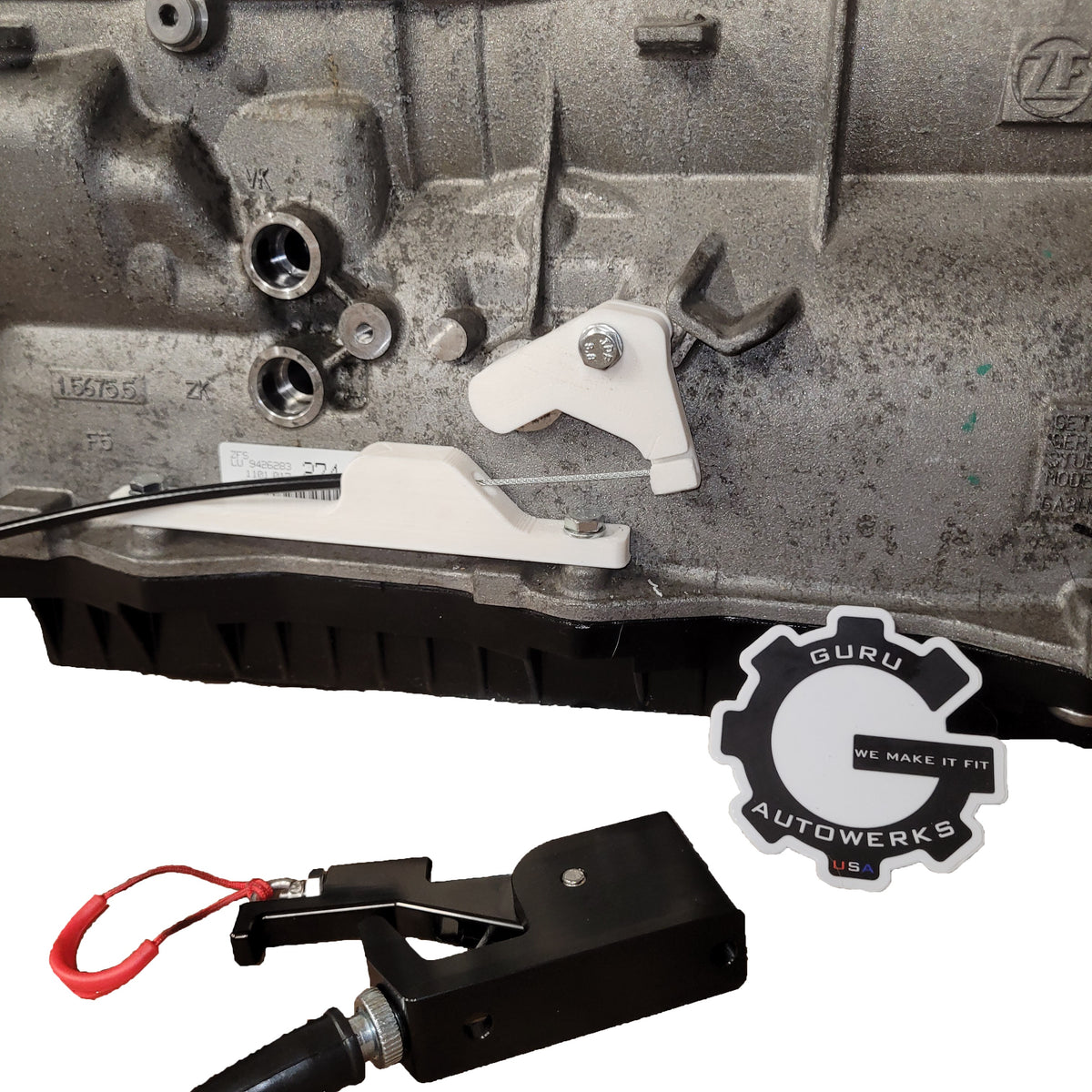 Guru Autowerks BMW Gen 2/3 8HP manual park release kit — prototype bracket and cable mechanism on the transmission